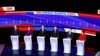Democratic presidential candidates stand on stage during a Democratic presidential primary debate hosted by CNN and the Des Moines Register in Des Moines, Iowa, Jan. 14, 2020. 