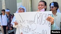 Cambodian environment activists react after the Cambodian court delivers verdict against activists from the Cambodian environmental group Mother Nature, on charges of plotting against the government and insulting the King, in Phnom Penh, Cambodia, July 2, 2024.