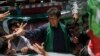 Imran Khan, Pakistani cricketer-turned-politician and chairman of political party Pakistan Tehreek-e-Insaf (PTI), cheers his supporters after his visit to the mausoleum of Mohammad Ali Jinnah, founder and first governor-general of Pakistan, during an elec