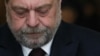French Justice Minister Eric Dupond-Moretti reacts after a tribunal's not-guilty verdict over alleged conflicts of interest and abuse of office, at a courthouse in Paris, on Nov. 29, 2023.