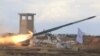 Rebel fighters from the First Regiment, part of the Free Syrian Army, fire a Grad rocket from Aleppo's al-Haidariya neighborhood, towards forces loyal to Syria's President Bashar al-Assad stationed in Talet al-Sheikh Youssef, Syria, May 29, 2016. 