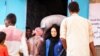 FILE - People in the Yemeni port city of Hudaydah have been provided with vouchers by the World Food Programme which they can exchange for food, March 2019.