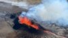 FILE - Lava spurts and flows after the eruption of a volcano in the Reykjanes Peninsula in Iceland on July 12, 2023. Officials reported on Oct. 27 that the same area felt thousands of small earthquakes this week. (Civil Protection of Iceland via Reuters)