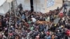 Palestinians gather to receive bread from a bakery, amid the Israel-Hamas conflict, amid the ongoing conflict between Israel and Hamas, in Deir Al-Balah in the central Gaza Strip, Nov. 29, 2024. 