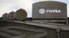 utouts depicting images of oil operations are seen outside a building of Venezuela's state oil company PDVSA in Caracas, Venezuela Jan. 28, 2019.