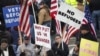 People gather to protest against the United States' acceptance of Syrian refugees at the Washington State capitol in Olympia, Washington, Nov. 20, 2015.