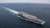 FILE - The Nimitz-class aircraft carrier USS Abraham Lincoln transits the Atlantic Ocean during a strait transit exercise, Jan. 30, 2019.