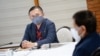 In this handout photo taken on Aug. 24, 2021 and received on Aug. 25 from the Presidential Photo Division (PPD), Senator Christopher Lawrence 'Bong' Go (L) listens to Philippine President Duterte (R). (AFP photo/Presidential Photo Division/King Rodrigues)