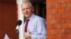 WikiLeaks founder Julian Assange makes a statement to the media and supporters at a window of Ecuadorian Embassy in central London, Aug. 19, 2012