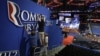 Workers place a Romney-Ryan campaign sign inside of the Tampa Bay Times Forum at the Republican National Convention in Tampa, Florida, Sunday, Aug. 26, 2012. 