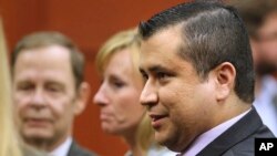 George Zimmerman leaves court with his family after Zimmerman's not guilty verdict was read in Seminole Circuit Court in Sanford, Florida, July 13, 2013. 