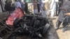 Pakistani security officials and residents gather at the site of a powerful explosion at a market in Parachinar, capital of the Kurram tribal district, on March 31, 2017.