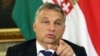 FILE - Hungarian Prime Minister Viktor Orban, shown at a September press conference, has become a divisive figure throughout Europe. 