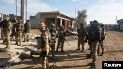 Les forces irakiennes à l'est de Mossoul, en Irak, le 22 décembre 2016.