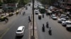 Few vehicles are seen plying on the otherwise severely busy Mehrauli Badarpur road during rush hour in New Delhi, India, Friday, April 15, 2016.