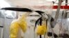 FILE - A health worker wearing Ebola protection gear works at an Ebola treatment center in Beni, in the Democratic Republic of Congo, April 1, 2019. 