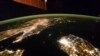 A NASA image released on February 24, 2014 shows a photo taken by the Expedition 38 crew aboard the International Space Station (ISS) on January 30, 2014 of the night view of the Korean Peninsula, and North Korea in the middle is almost completely dark compared to neighboring Sou