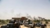 Smoke rises from Islamic State positions as Iraqi federal police take combat positions at the front line during fight against IS outside Fallujah, May 28, 2016. 