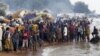 Burundian refugees gather on the shores of Lake Tanganyika in Kagunga village, western Tanzania, May 17, 2015.