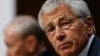 U.S. Secretary of Defense Chuck Hagel (R) and Chairman of the Joint Chiefs of Staff U.S. Army General Martin Dempsey testify before the Senate Armed Services Committee on Capitol Hill in Washington, March 5, 2014.