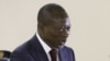 Patrice Talon recevant le rapport des mains du président de la commission, le ministre de la justice Joseph Djogbenou.