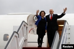 FILE - U.S. Vice President Mike Pence and his wife, Karen, wave as they prepare to depart Ben Gurion International Airport, near Tel Aviv, Israel, Jan. 23, 2018. The Pences leave Monday for a trip to Northeast Asia, including a stop at the Pyeongchang Games.