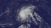 FILE - Satellite image released by the US National Oceanic and Atmospheric Administration, shows Hurricane Danny over the Atlantic Ocean, Aug. 21, 2015.