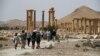 FILE - Tourists visit Roman ruins in Palmyra, Syria, on May 11, 2023. Syrian state-run media reported on Nov. 20, 2024, that a strike on the historic town killed 36 people. Syrian leaders blamed Israel.