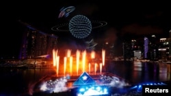 Drones perform an aerial display over Marina Bay during New Year's Eve celebrations ahead of the new year in Singapore Dec. 31, 2019. 