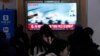 A TV screen shows a file image of a North Korean military exercise during a news program at the Seoul Railway Station in Seoul, South Korea, on Jan. 6, 2024, after North Korea fired over 60 artillery rounds near Yeonpyeong Island.