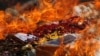 Confiscated drugs burned during a ceremony to mark the International Day against Drug Abuse and Illicit Trafficking, in Phnom Penh, Cambodia, June 26, 2018. REUTERS/Samrang Pring