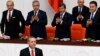 Turkey's President Recep Tayyip Erdogan, lower left, attends a debate marking the reconvening of parliament after a summer recess at the Turkish Parliament in Ankara, Oct. 1, 2014. 