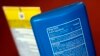 FILE - Sunscreen ingredients, including oxybenzone, are shown, in San Jose, Calif., May 2, 2018. In an attempt to protect the coral reefs, the Pacific nation of Palau will soon ban many types of sunscreen. The law defines reef-toxic sunscreen as containin