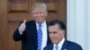 Le président élu Donald Trump salue Mitt Romney alors qu'il part du club de golf de Bedminster à Bedminster, le 19 novembre 2016.
