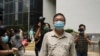 Pro-democracy activist Cheung Man-kwong walks out of a court after receiving a suspended sentence in Hong Kong, Wednesday, Sept. 15, 2021. Nine Hong Kong activists and ex-lawmakers were handed jail sentences of up to 10 months, and three others…