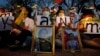 Myanmar nationals living in Thailand attend a candle light vigil as they protest against the military coup in front of the United Nations building in Bangkok, Thailand, Thursday, March 4, 2021. (AP Photo/Sakchai Lalit)