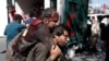 A man carries an injured attack victim to a hospital after a blast in Kabul, Afghanistan May 31, 2017. 