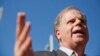 Alabama Democrat Senate candidate Doug Jones speaks to the media, Nov. 14, 2017, in Birmingham, Alabama. President Donald Trump attacked Jones as a lawmaker who would be a "puppet" to party leaders if he is elected next month.