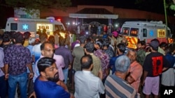 People gather outside after a stampede at the venue of a music concert at the Cochin University of Science and Technology in Kochi, Kerala state, India, on Nov.25, 2023. Four people died and dozens of students were injured in the incident.