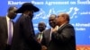 South Sudan President Salva Kiir, Sudan's President Omar Al-Bashir and South Sudan rebel leader Riek Machar talk after signing a peace agreement aimed to end a war in which tens of thousands of people have been killed, in Khartoum, Sudan, June 27, 2018. 