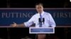 Republican presidential candidate Mitt Romney gestures during a campaign stop at Production Products in St. Louis, Missouri, June 7, 2012.