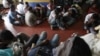 Would-be illegal asylum seekers from Sri Lanka are seen at a police station in Colombo, after attempting to sail to Australia illegally by boat, May 28, 2012.