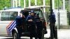 Belgian police stand guard outside, on the sideline of searches conducted at the European Parliament building as part of a Belgian probe into suspected Russian interference and corruption in Brussels on May 29, 2024.
