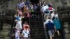 Tourists visit the Angkor Wat temple in Siem Reap, Cambodia, Wednesday, March 14, 2018. The temples were built between the 9th and 15th centuries. (AP Photo/Heng Sinith)