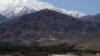FILE - Smokes rises from the area during an operation near the area bombed by U.S. forces in the Achin district of Jalalabad, east of Kabul, Afghanistan, April 14, 2017. 