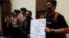 FILE - Journalists take part in a protest against the recent imprisonment by Myanmar authorities of Reuters journalists Wa Lone, 32, and Kyaw Soe Oo, 28, outside the Myanmar embassy in Jakarta, Indonesia, Sept. 7, 2018. 