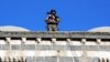 FILE - A special security member stands atop a historical building a day after seven police officers were killed in an explosion caused by a bomb-laden car, in the mainly Kurdish city of Diyarbakir, Turkey, April 1, 2016.