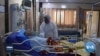 A Year of the Pandemic: In Middle East, Coronavirus Compounds Conflict 