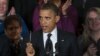 President Barack Obama holds up a pen as he speaks about the economy and the deficit in the East Room of the White House in Washington, file photo. 