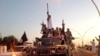FILE - Fighters from the Islamic State group parade in a commandeered Iraqi security forces armored vehicle down a main road at the northern city of Mosul, Iraq.